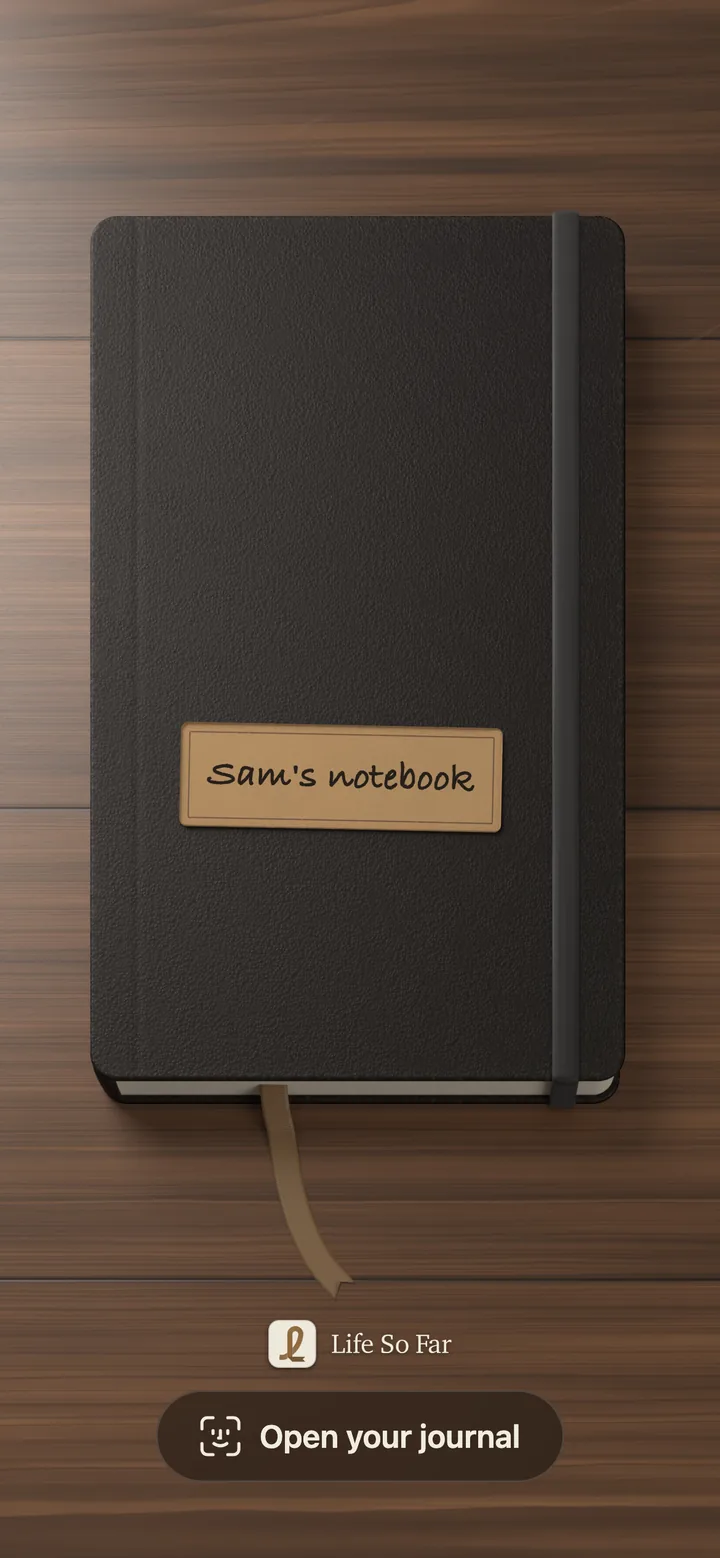 A black notebook labeled Sam’s notebook, on a wooden desk.